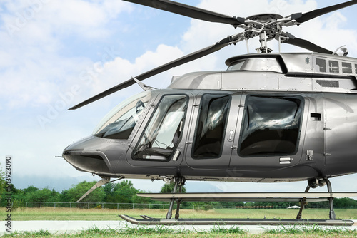 Beautiful modern helicopter on helipad in field Fototapet