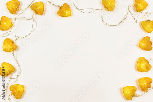 Bright orange lanterns in the shape of hearts. Top view, a holiday card with a white background. Space for text. 