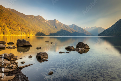 A dreamy afternoon at Chilliwack Lake in British Columbia, Canada. Sunshine and Smoke from forest fires created this surreal dreamy haze.  photo