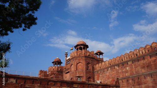 Red Fort with moody skies at sunset Delhi UNESCO World Heritage Site Red Fort in India A heritage site made of red sandstone during the Mughal rule photo