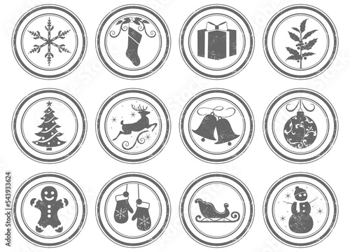 A set of 12 unique grunge stamps, Christmas themed. Each stamp is isolated, grouped, labeled, and on an individual layer.
