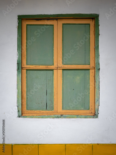 Green and Yellow Window and a White Background  Characteristic of the Town of Jerico  Antioquia  Colombia