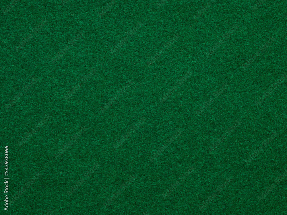 Dark green felt background of suede fabric surface. Texture for text, lettering, patchworkor other art. Full frame backdrop wallpaper of art and stationery work. Velvet pattern of mint poker table.