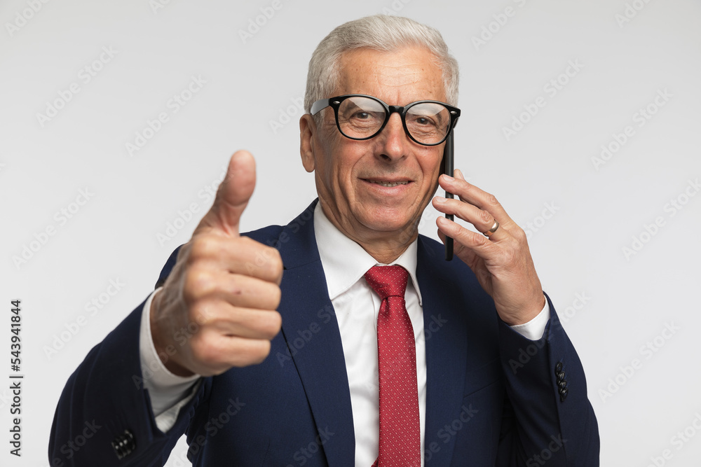 Businessman giving ok sign and showing the conversation went ok Businessman giving ok sign and showing the conversation went ok