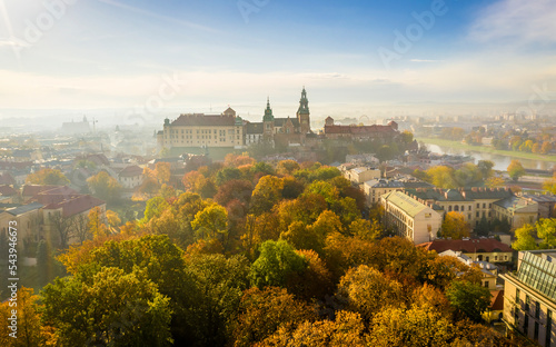 Panorama of Krakow Old Town and Wawel Royal Castle at misty morning, Krakow, Poland