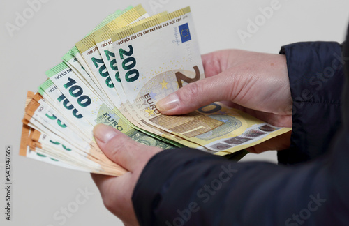 woman holding euro banknotes