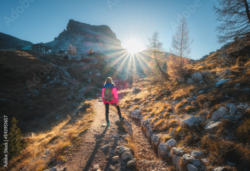 Walking girl with backpack ...