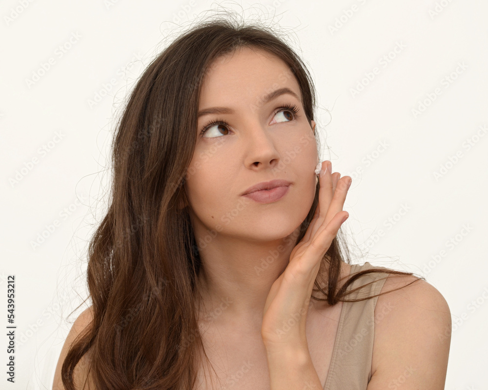 a woman applying a feca cream a woman applying a feca cream