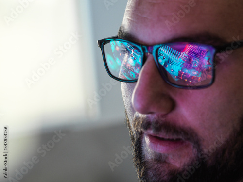 AI Technology, Circuit board reflected in glasses photo