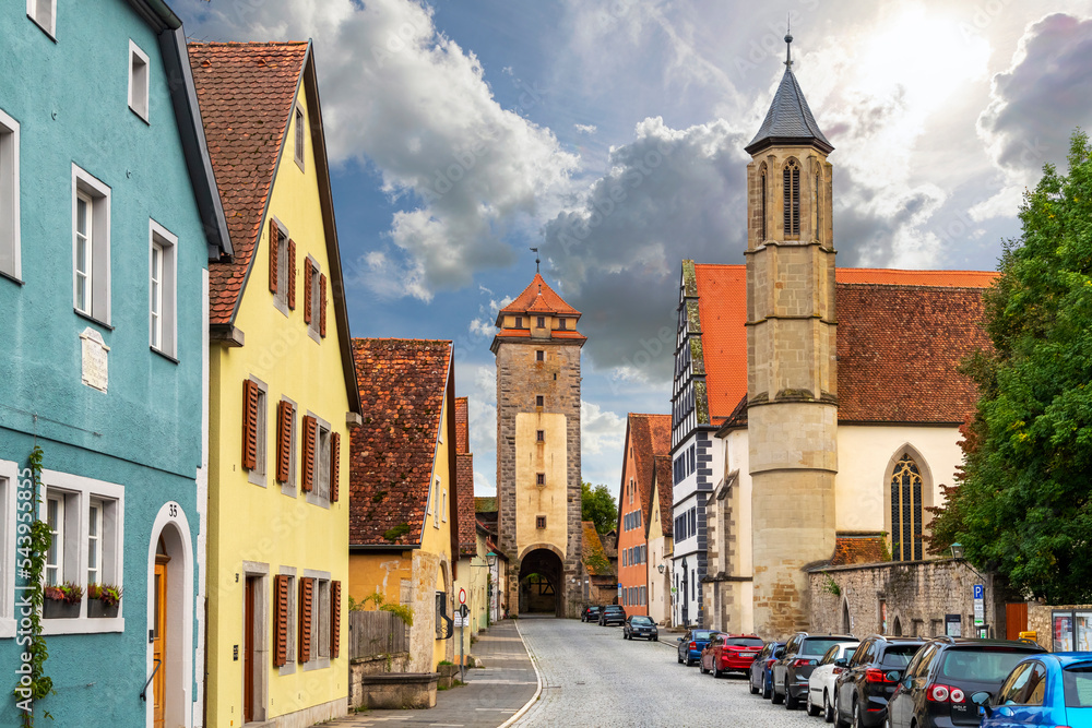 View of the Spital Bastion from one of the many picturesque streets of half-timbered buildings in Rothenburg ob Der Tauber, Germany. 