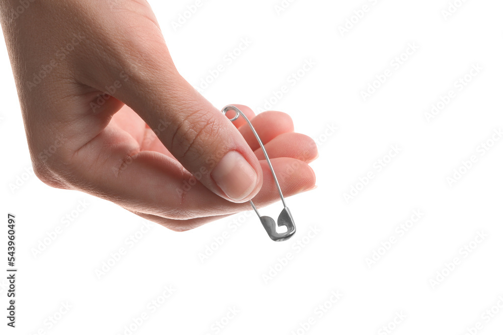 Woman holding safety pin on white background, closeup Woman holding safety pin on white background, closeup