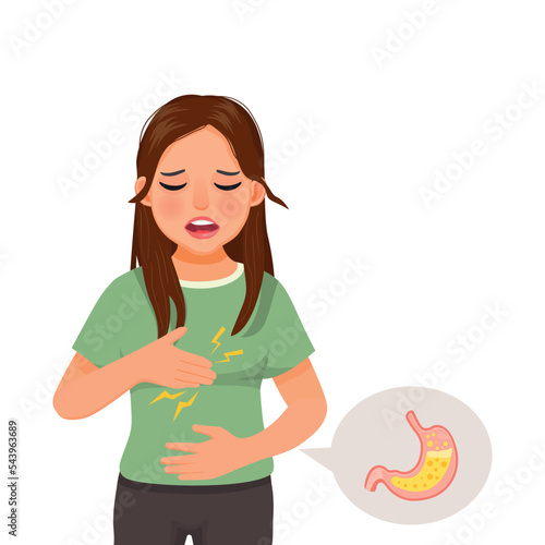 Young woman suffering from acid reflux holding her chest feeling heartburn sensation