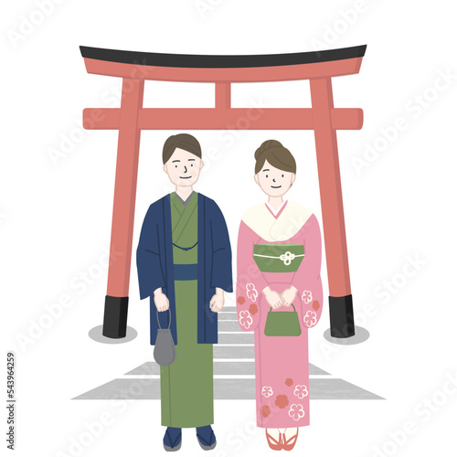 鳥居の前の着物姿の男性と女性