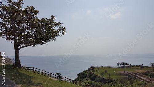 Okinawa, Japan. View from Cape Chinen Park. Horizontal and clam ocean with green nature. photo