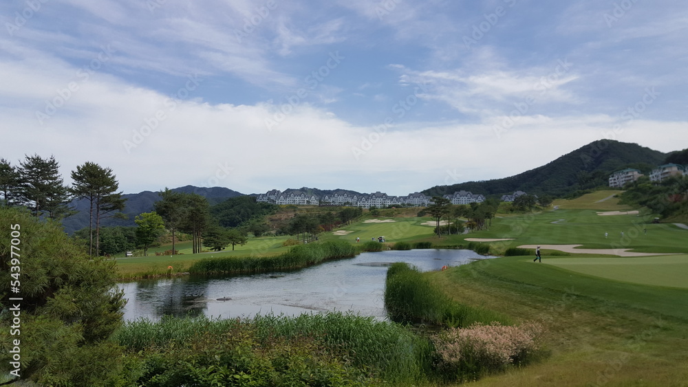 Panorama view of golf course in Korea. Beautiful scenery with blue sky.