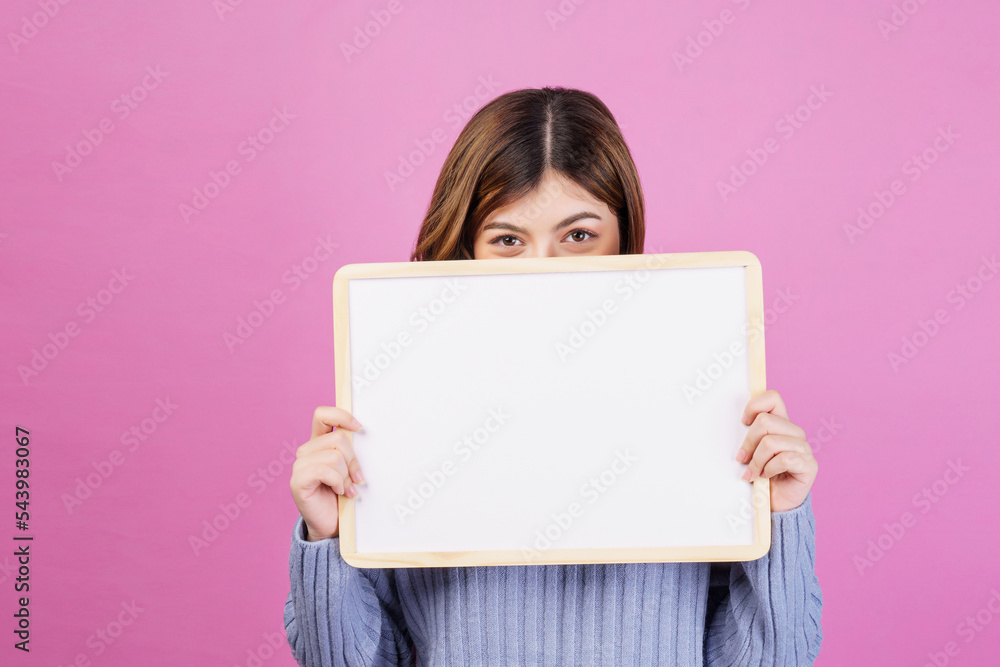 Portrait of Happy young woman holding an empty white placard over isolated pink background. Portrait of Happy young woman holding an empty white placard over isolated pink background.