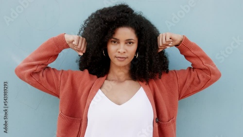 Black woman, portrait and strong arm of black girl feeling empowered and proud on studio background. Success, winning and motivation with african american female posing in power, strength mindset