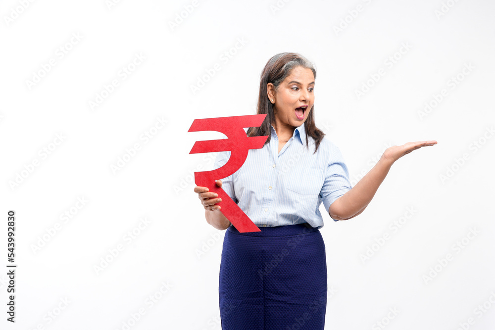Indian senior lady holding rupees symbol in hand on white background. Indian senior lady holding rupees symbol in hand on white background.