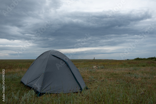 Small tent by the sea. Rest at nature. Day. Summer. Mainly cloudy.