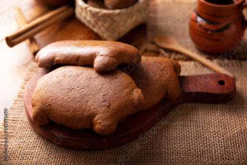 Cochinitos de Piloncillo. Also called Cochinitos, Cerditos or Chichimbres. Traditional Mexican sweet bread with pig shape, usually eaten with pot coffee or hot chocolate. photo