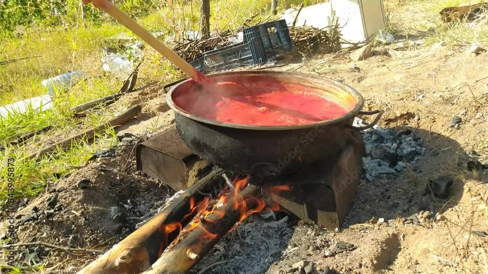 tomato paste boiling in the fire in the garden