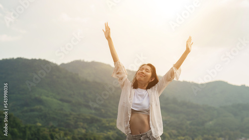 woman looking at the view enjoy the mountains.happy women enjoying nature travel.Female tourists see nature on the top of the mountain.