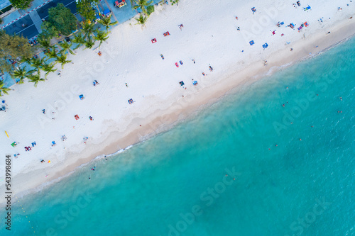 Aerial view of amazing beach with people relax on the beach sea, Beautiful Patong beach Phuket Thailand, Amazing sea beach sand tourist travel destination in andaman sea, Travel and tour concept