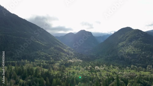 Wide drone shot of the Cascade Mountains filled with abundant forests. photo