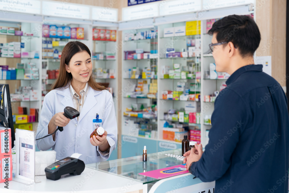 Asian pharmacist woman in pharmacy store Asian pharmacist woman in pharmacy store