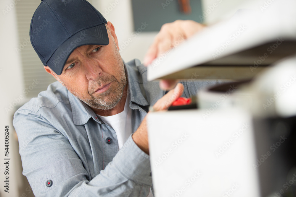 man installing kitchen - diy concept man installing kitchen - diy concept