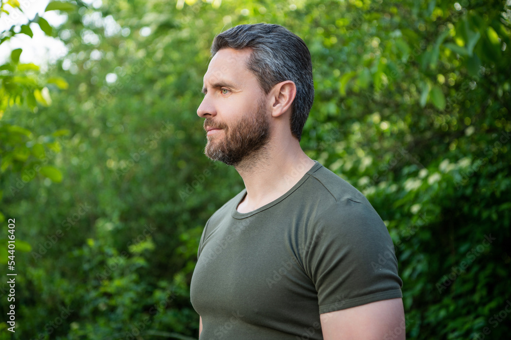 profile view of bearded man in shirt. caucasian man with beard. mature man outdoor profile view of bearded man in shirt. caucasian man with beard. mature man outdoor