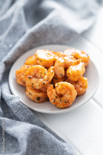 Grilled tiger shrimps on plate.