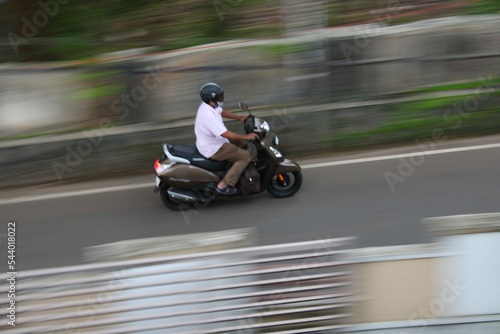 Man in scooter riding in the city