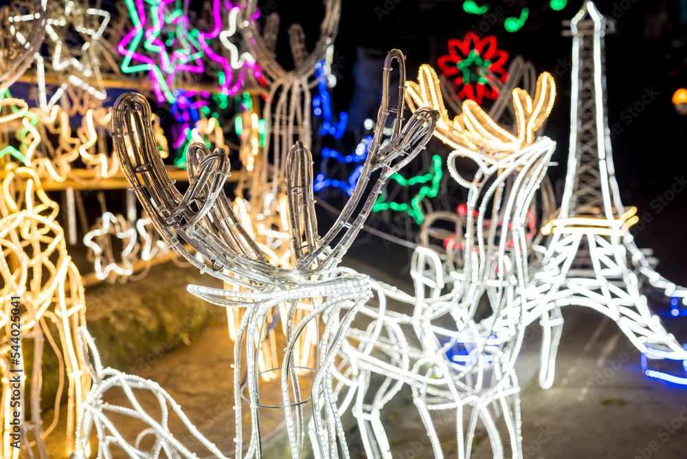 Outdoor Reindeer Christmas Decorations made with wire and LED wall strips. For sale with other decor at a stall.
