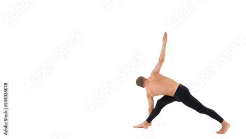 Young attractive man stretches before training.