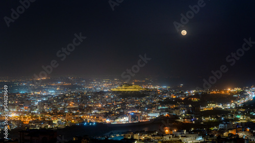 Abha city at night with full moon photo