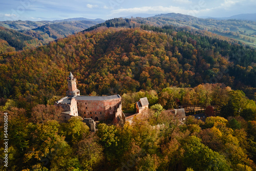 Fototapeta Naklejka Na Ścianę i Meble -  Aerial top view of Grodno castle in Zagorze with beautiful autumn landscape. Old historical fortress in mountains, covered with forest. Poland landmarks for tourists