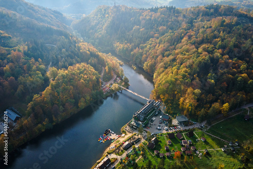 Wallpaper Mural Recreation area near Grodno castle in Zagorze, Poland. Beaituful autumn landscape with mountains covered with forest, river and bridge for people over it Torontodigital.ca