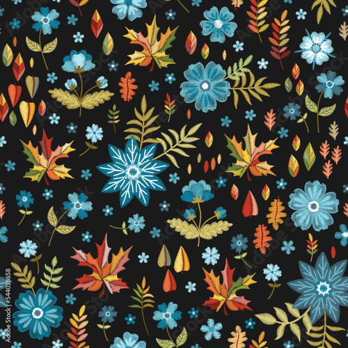 Colorful seamless pattern with embroidered flowers and leaves on black background