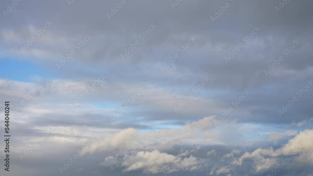 Beautiful clear blue sky and white fluffy clouds. 4k stock video time lapse of amazing peaceful sunny cloudscape. White soft fluffy clouds flying slowly high in sunny blue heaven. Natural background Beautiful clear blue sky and white fluffy clouds. 4k stock video time lapse of amazing peaceful sunny cloudscape. White soft fluffy clouds flying slowly high in sunny blue heaven. Natural background