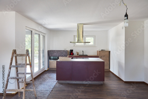 Papier peint Kitchen island in eat-in kitchen during painting work in new building