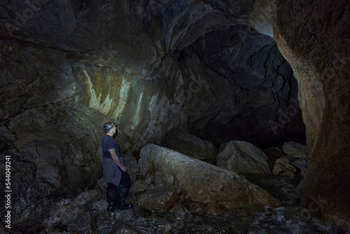 Man hiking into a cave