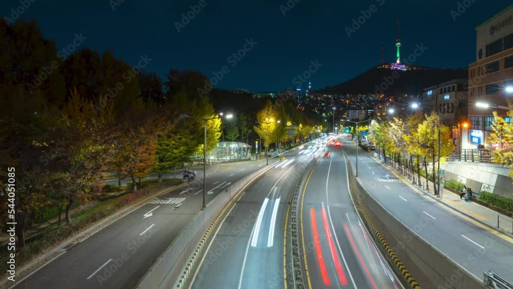 Night crowded city street in Itaewon District with Namsan tower or N Seoul Tower, transportation scene time lapse in Seoul Yongsan-gu district Night crowded city street in Itaewon District with Namsan tower or N Seoul Tower, transportation scene time lapse in Seoul Yongsan-gu district