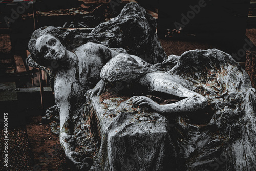 sepulchral sculpture of two angels in agony, monumental cemetery photo