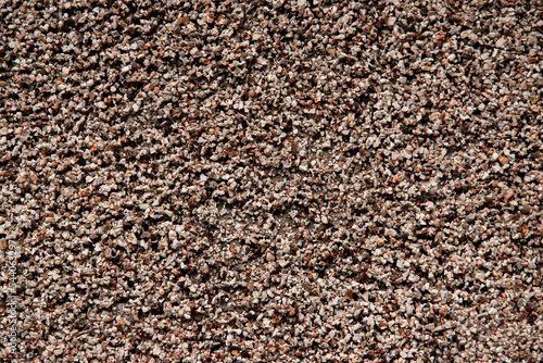 Top view of brown small stones textured rough background.