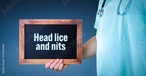 Head lice and nits. Doctor shows sign/board with wooden frame. Background blue