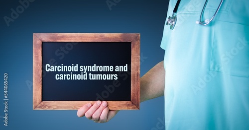 Carcinoid syndrome and carcinoid tumours. Doctor shows sign/board with wooden frame. Background blue photo