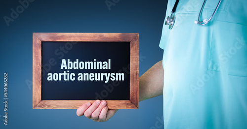 Abdominal aortic aneurysm (AAA). Doctor shows sign/board with wooden frame. Background blue photo