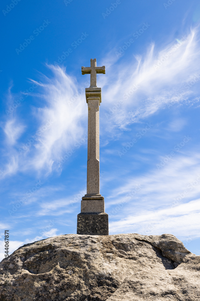 Typical Galician cross called Cruceiro with a sunny blue sky background Typical Galician cross called Cruceiro with a sunny blue sky background