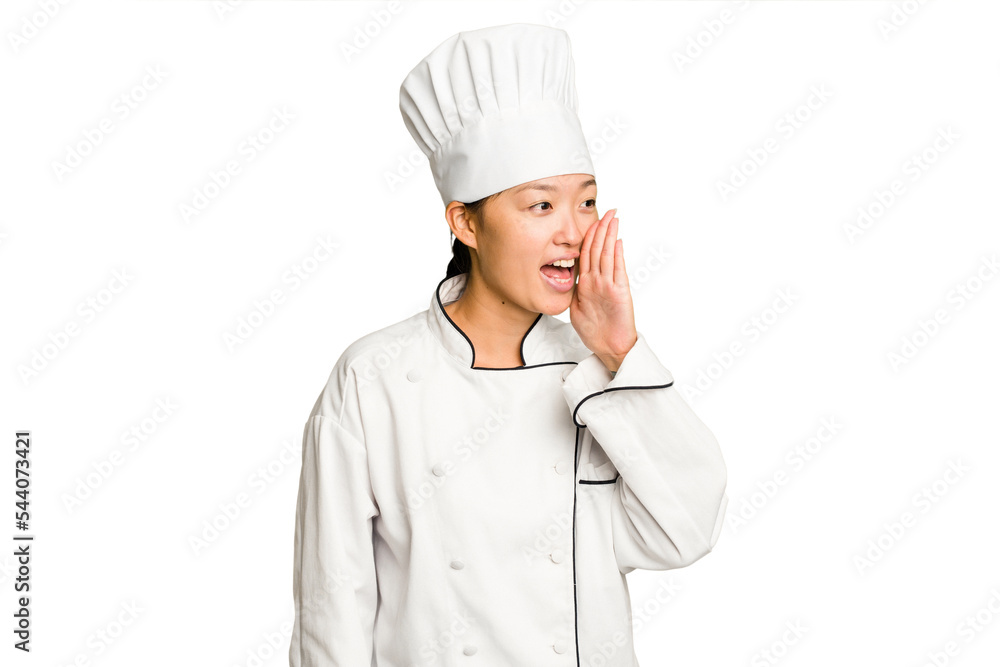 Young asian cook woman isolated shouting and holding palm near opened mouth. Young asian cook woman isolated shouting and holding palm near opened mouth.